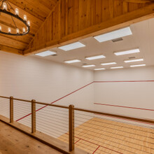 loft overlooking an indoor squash court